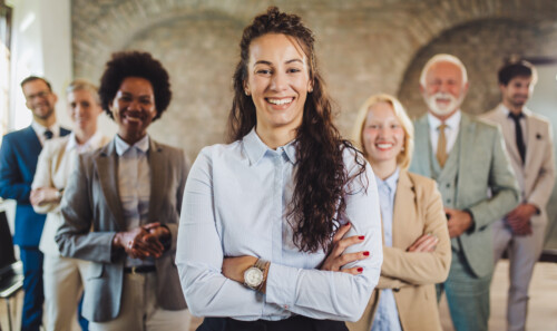 Portrait of successful group of business people at modern office